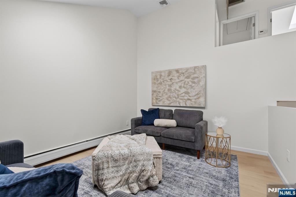 7 Hopson Avenue, Unit B Little Falls, NJ 07424 - Photo 7 of 24 a living room with furniture and a rug