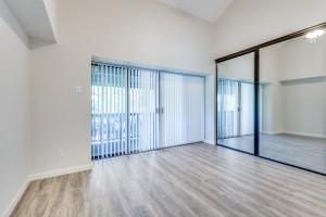 4539 North O'Connor Road, Unit 2233 Irving, TX 75062 - Photo 9 of 11 an empty room with wooden floor and a window