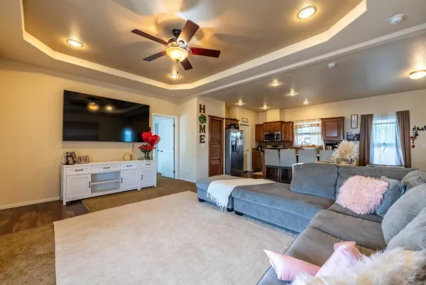 a living room with furniture and a flat screen tv