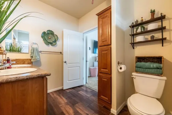 a bathroom with a toilet sink and shower