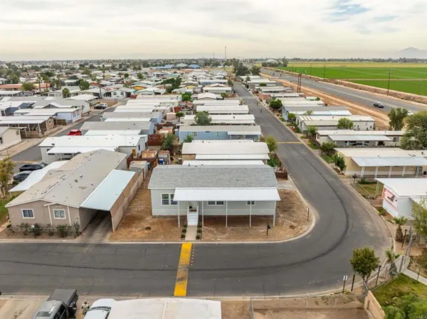 an aerial view of residential houses with outdoor space
