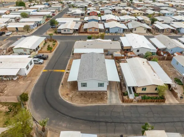 an aerial view of residential houses with outdoor space