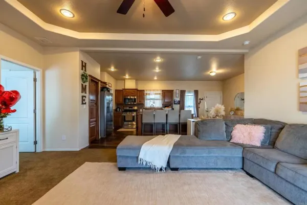 a spacious bedroom with a bed and a couch