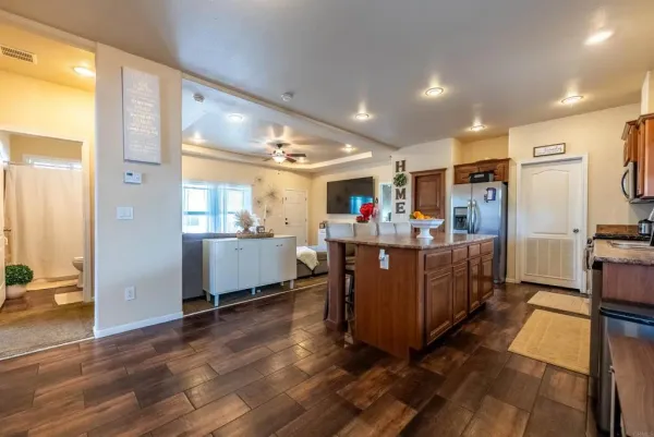 a view of a kitchen and dining room with furniture a window