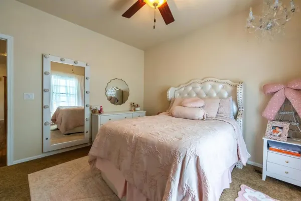 a bedroom with a bed and window