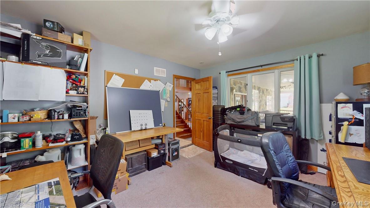 75 Monahan Road Port Jervis, NY 12771 - Photo 20 of 36 a view of a workspace with furniture and a window