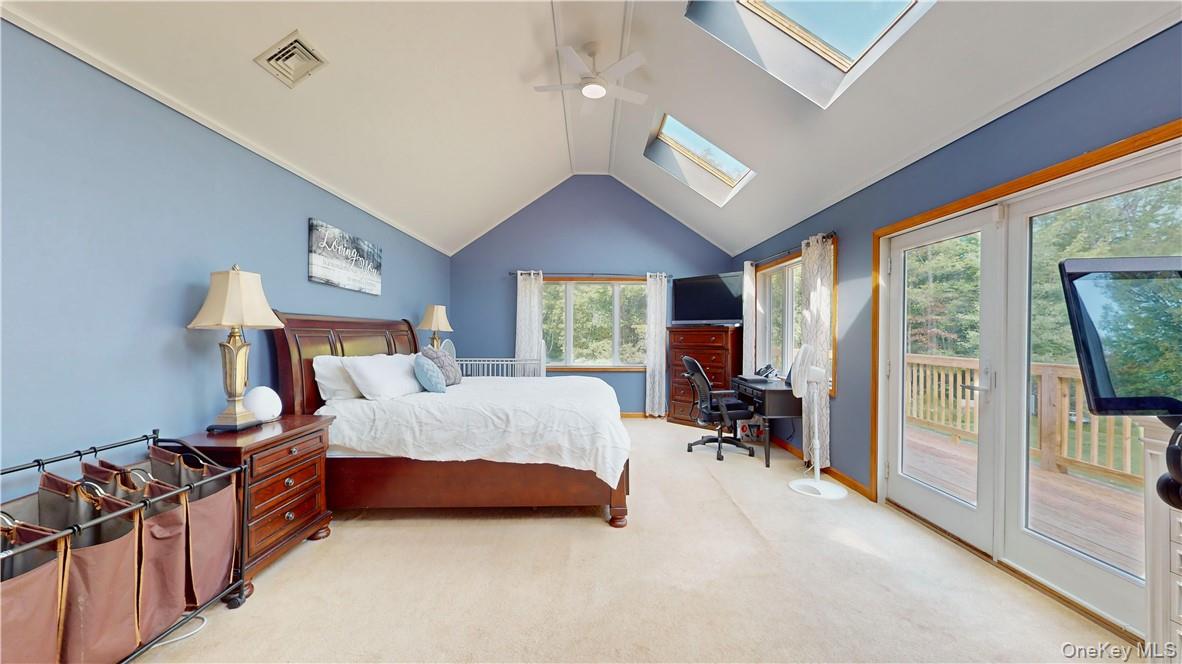 75 Monahan Road Port Jervis, NY 12771 - Photo 25 of 36 a bedroom with a bed and large windows