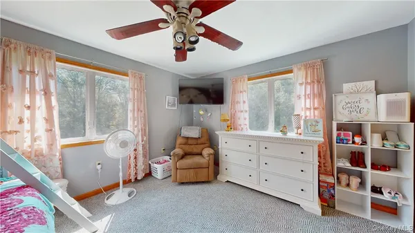 a bed room with a bed and a window