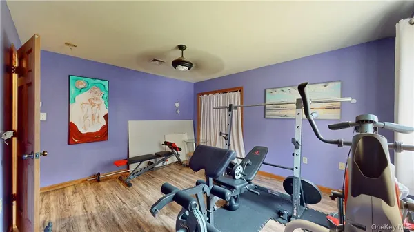 a work room with furniture and wooden floor