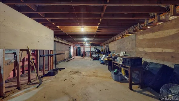 a view of empty room with wooden ceiling