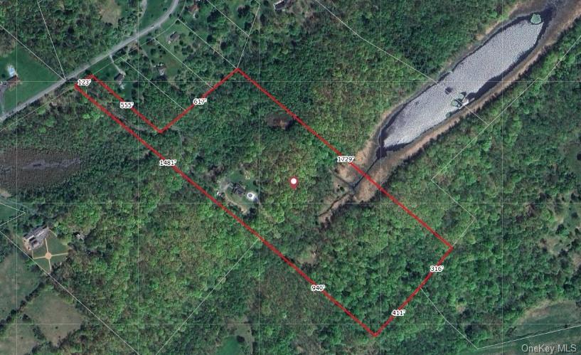 75 Monahan Road Port Jervis, NY 12771 - Photo 35 of 36 a backyard of a house with lots of trees