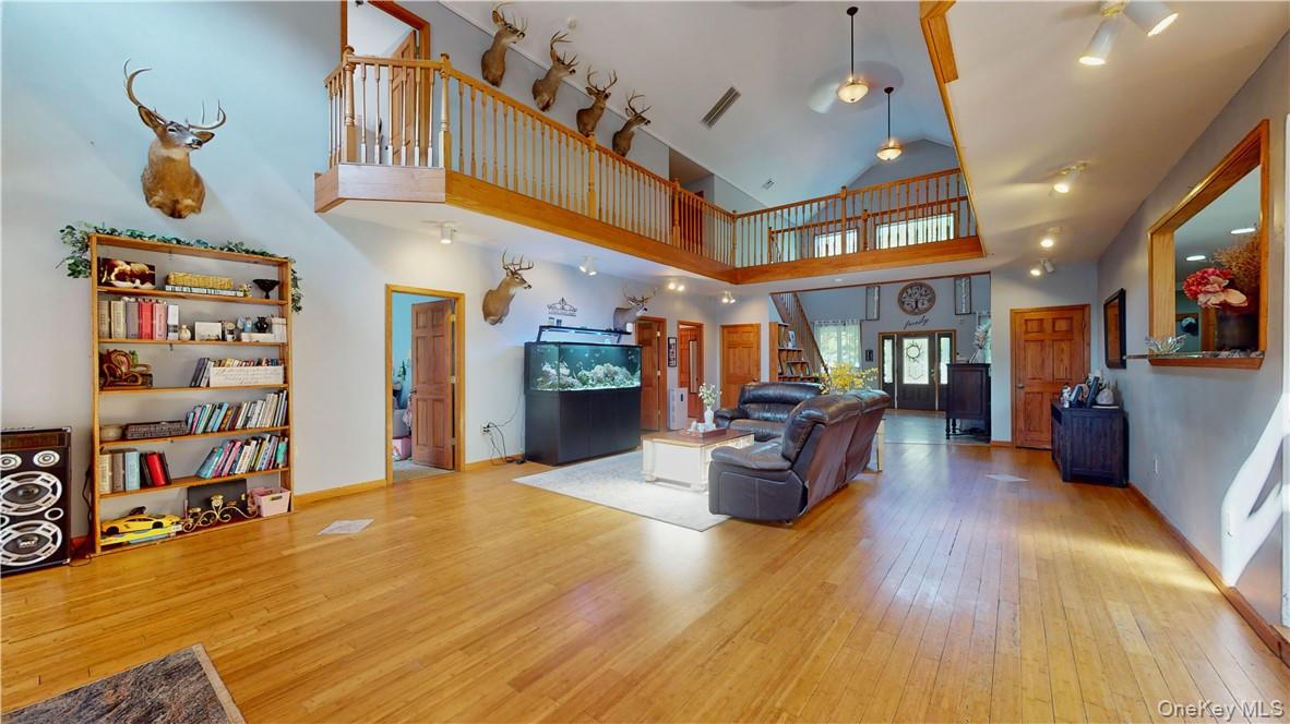 75 Monahan Road Port Jervis, NY 12771 - Photo 4 of 36 a living room with furniture and a book shelf