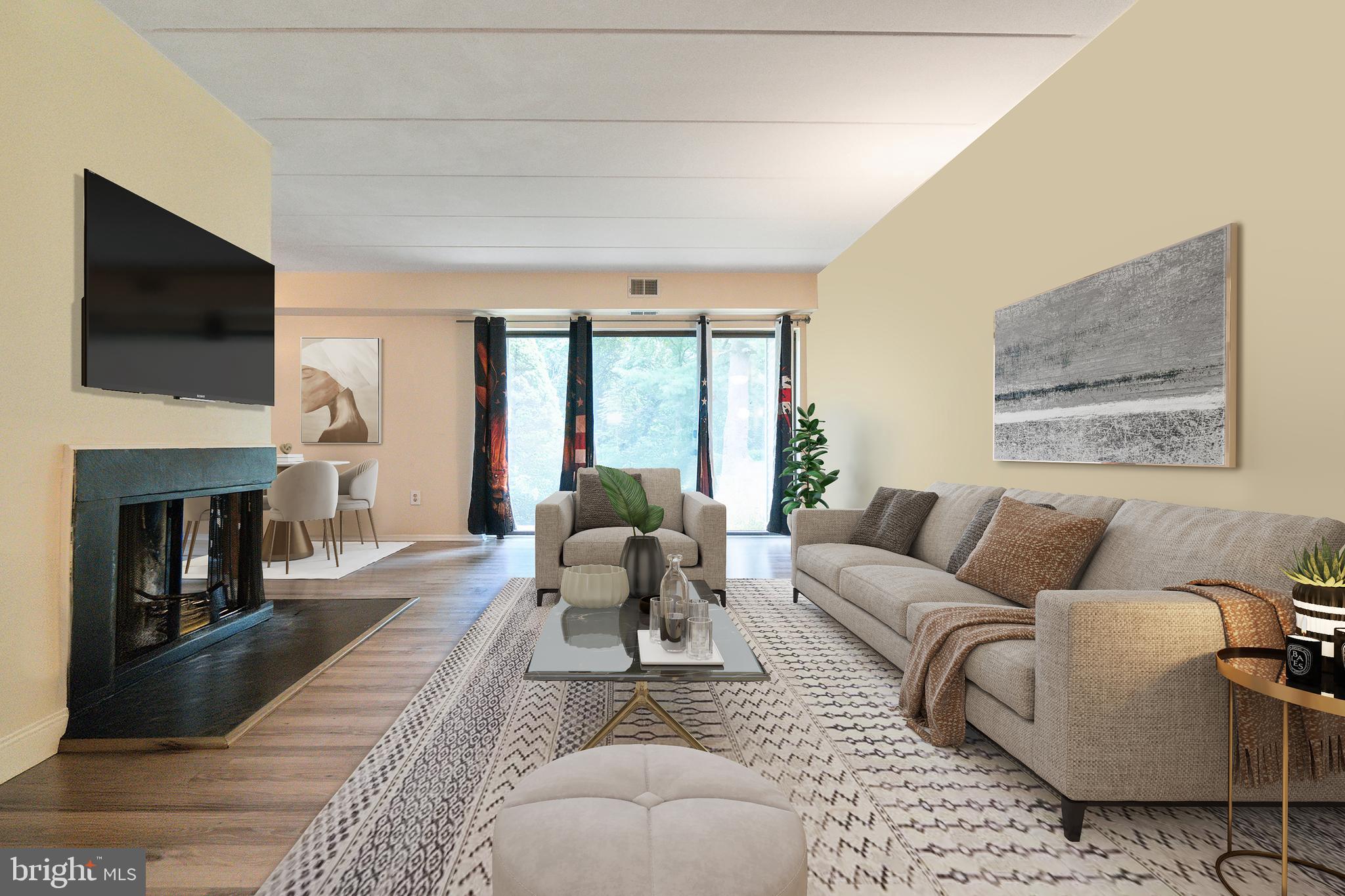 5390 Smooth Meadow Way, Unit B2D02 Columbia, MD 21044 - Photo 1 of 28 a living room with furniture fireplace and flat screen tv