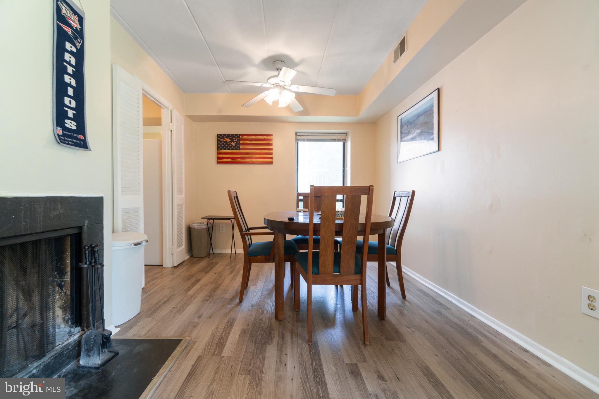 5390 Smooth Meadow Way, Unit B2D02 Columbia, MD 21044 - Photo 14 of 28 a view of a dining room with furniture and wooden floor