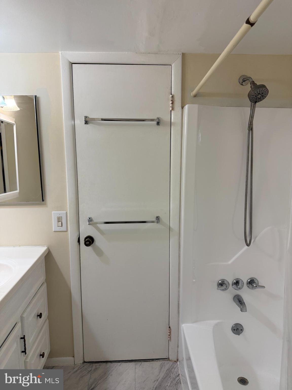 5390 Smooth Meadow Way, Unit B2D02 Columbia, MD 21044 - Photo 16 of 28 a bathroom with a tub a sink and a shower