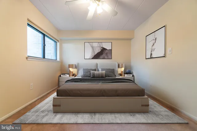 a bedroom with bed and window