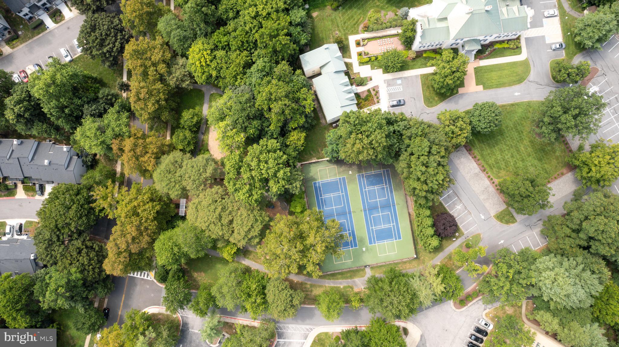 5390 Smooth Meadow Way, Unit B2D02 Columbia, MD 21044 - Photo 25 of 28 an aerial view of a house with a yard
