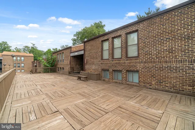 a view of a backyard with sitting area