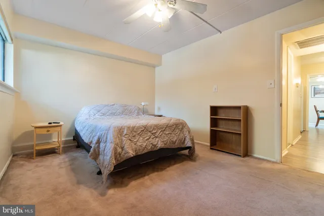 a bedroom with a bed and a cabinets