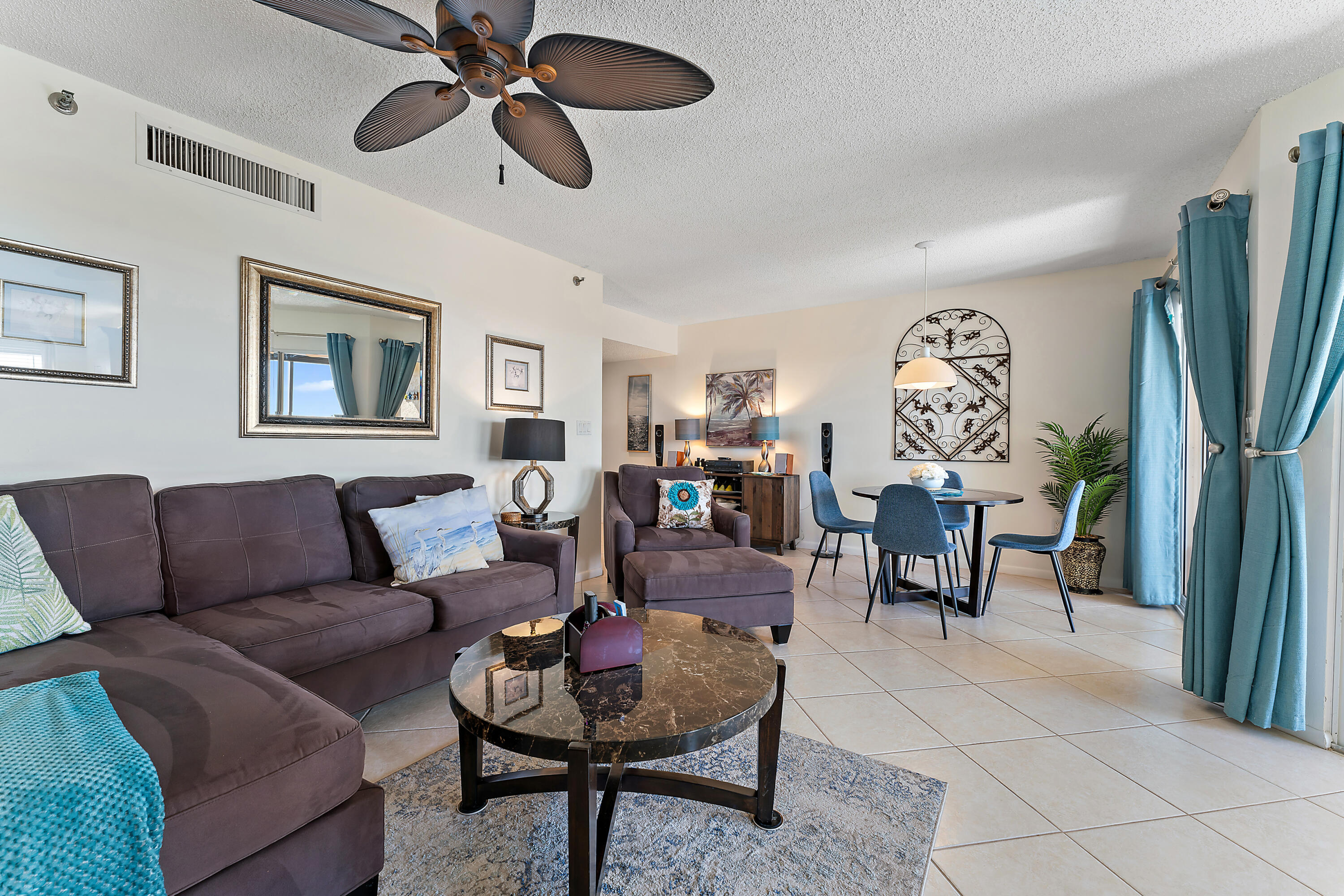 275 Palm Avenue, Unit C503 Jupiter, FL 33477 - Photo 5 of 10 a living room with furniture and a flat screen tv