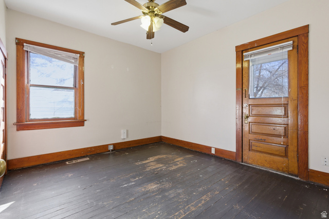 869 West Center Street Provo, UT 84601 - Photo 17 of 32 Empty room with dark wood-type flooring and a ceiling fan