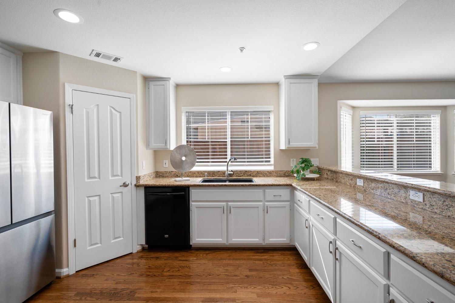 1363 Rincon Avenue Livermore, CA 94551 - Photo 15 of 65 a kitchen with granite countertop a sink and a window