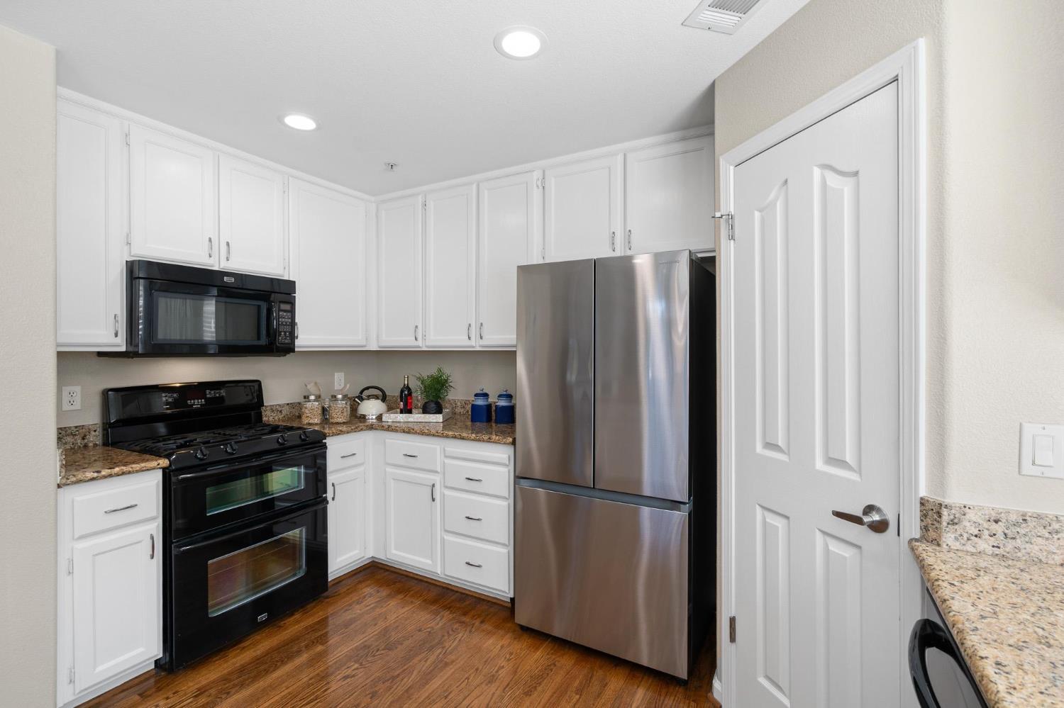 1363 Rincon Avenue Livermore, CA 94551 - Photo 17 of 65 a kitchen with stainless steel appliances a refrigerator stove and microwave