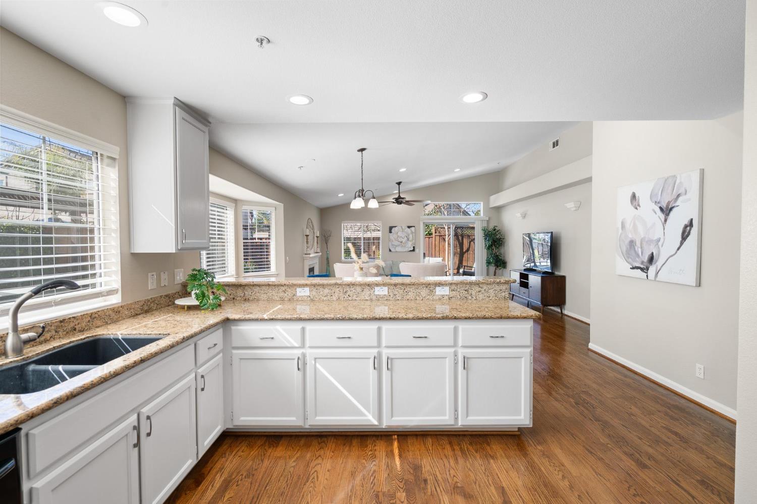 1363 Rincon Avenue Livermore, CA 94551 - Photo 19 of 65 a large kitchen with a lot of counter space and wooden floor