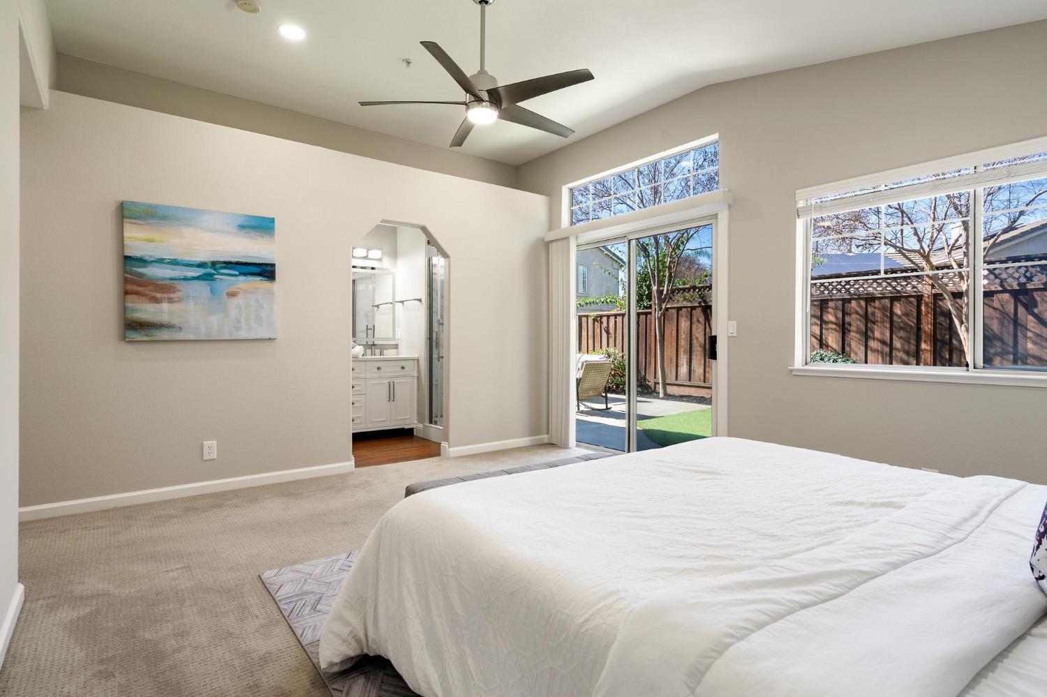 1363 Rincon Avenue Livermore, CA 94551 - Photo 35 of 65 a bedroom with a large bed chandelier and a window