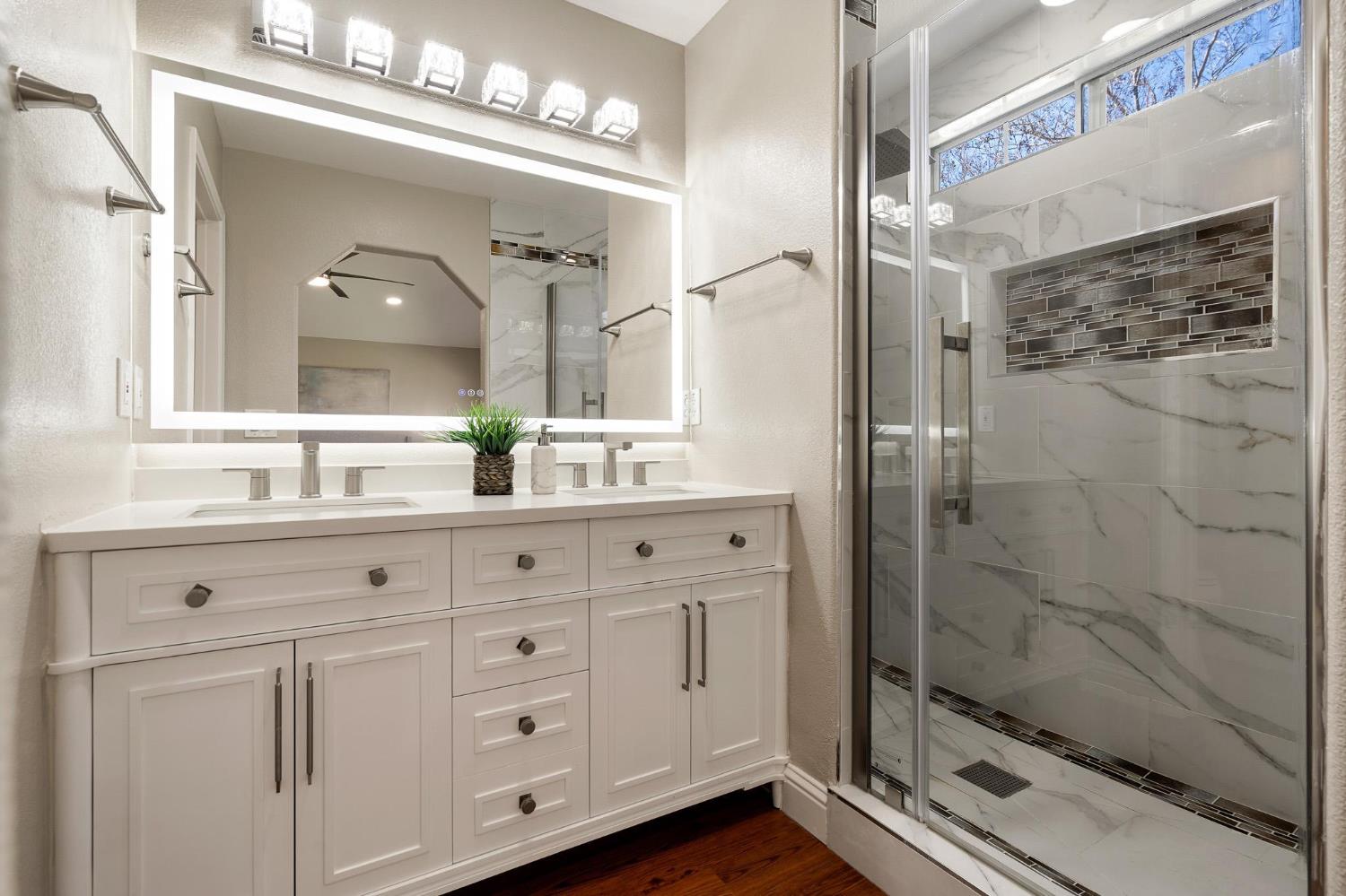 1363 Rincon Avenue Livermore, CA 94551 - Photo 37 of 65 a bathroom with double vanity and a shower