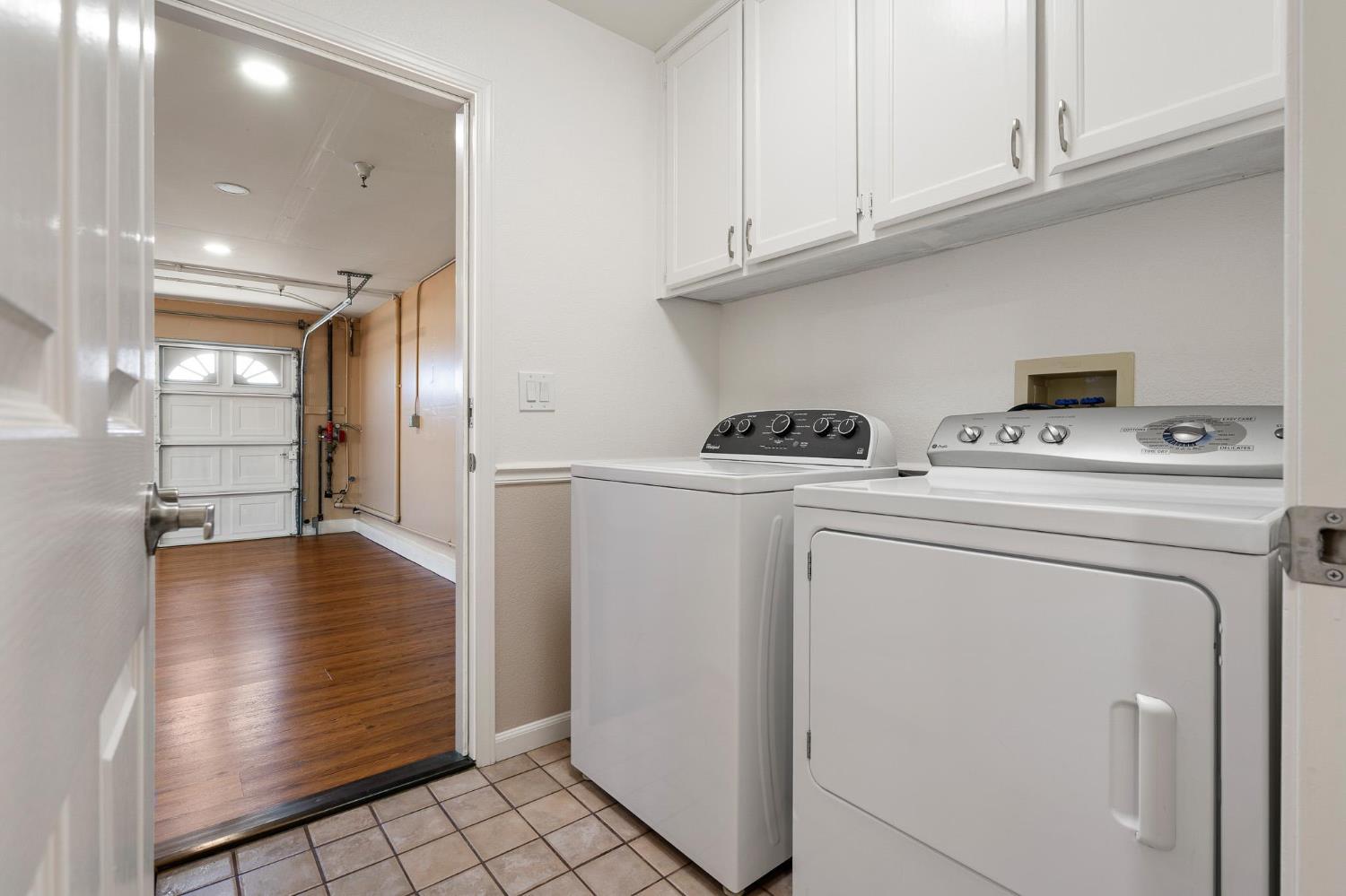1363 Rincon Avenue Livermore, CA 94551 - Photo 51 of 65 a view of washer and dryer with kitchen in the background