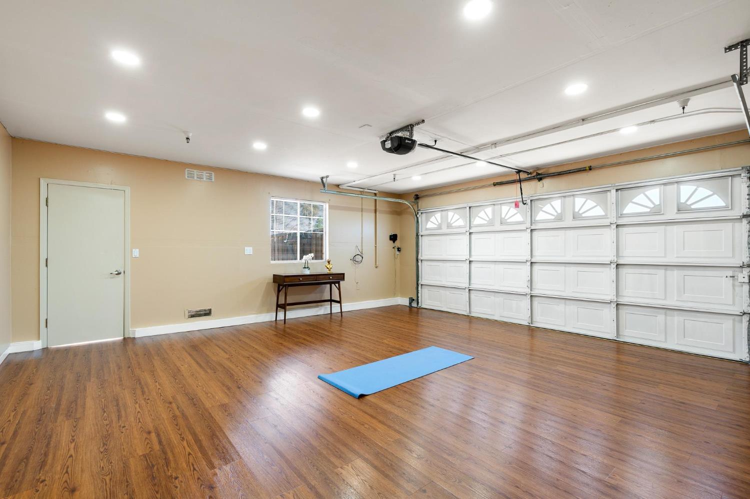 1363 Rincon Avenue Livermore, CA 94551 - Photo 53 of 65 a view of an empty room with wooden floor and a window