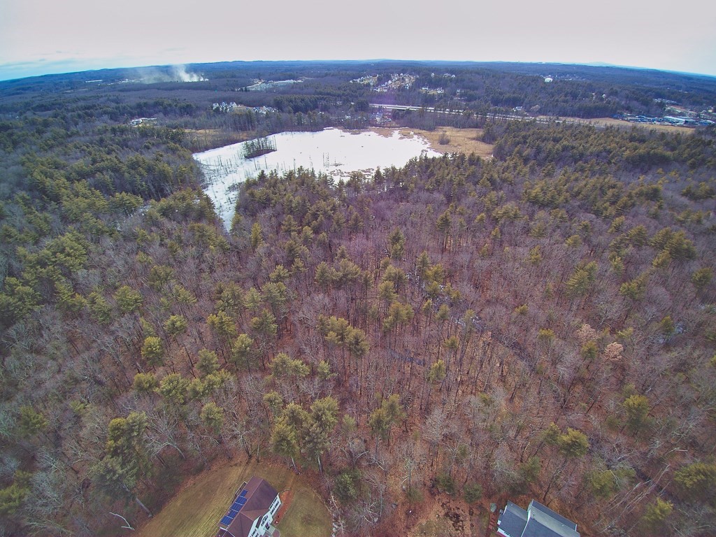 24 Old Tyng Road Tyngsborough, MA 01879 - Photo 12 of 15 a view of a dry field with trees in the background