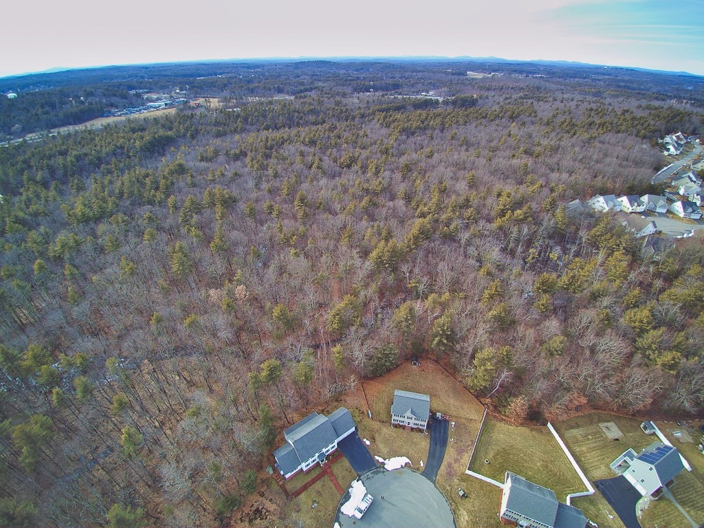 24 Old Tyng Road Tyngsborough, MA 01879 - Photo 13 of 15 a view of a city with lush green forest