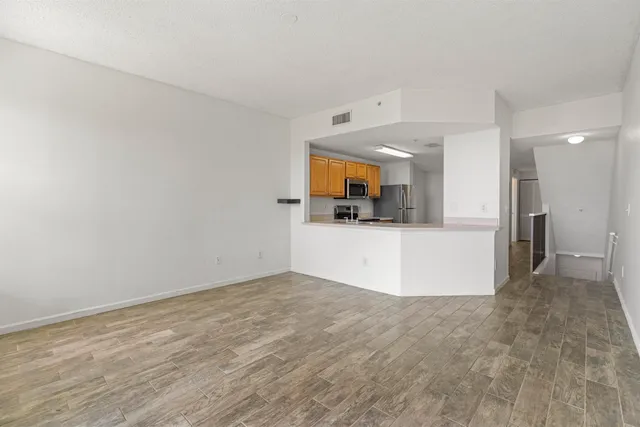 a view of a kitchen with a sink and a microwave