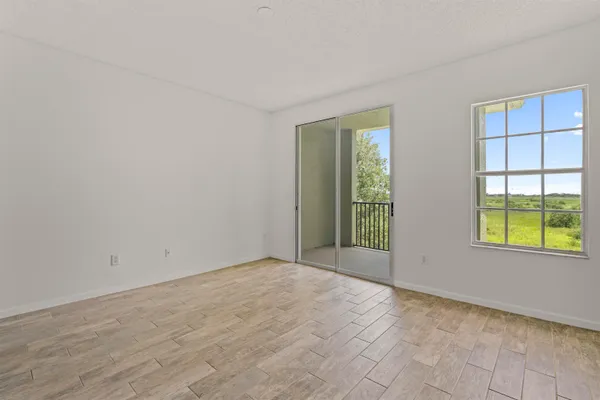 a view of an empty room with a window