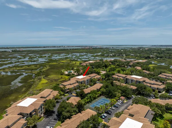 an aerial view of residential building and ocean