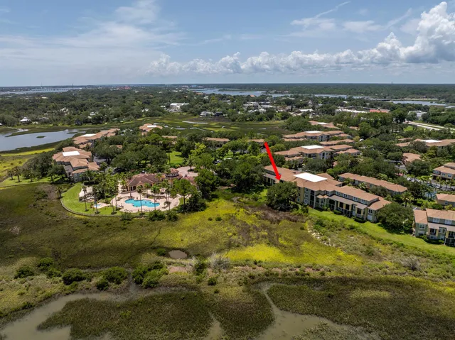 an aerial view of residential houses with outdoor space