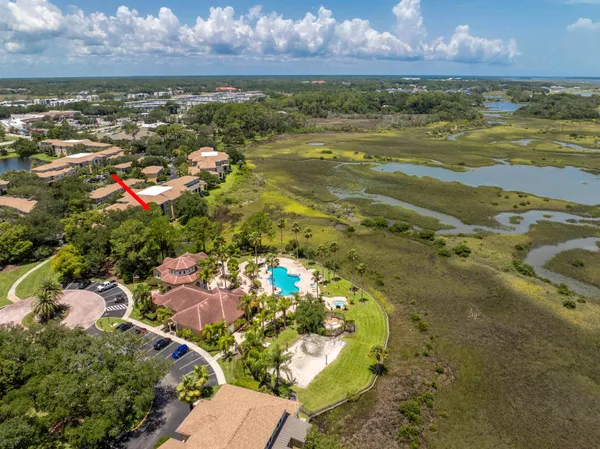 a view of a garden with a building in the background