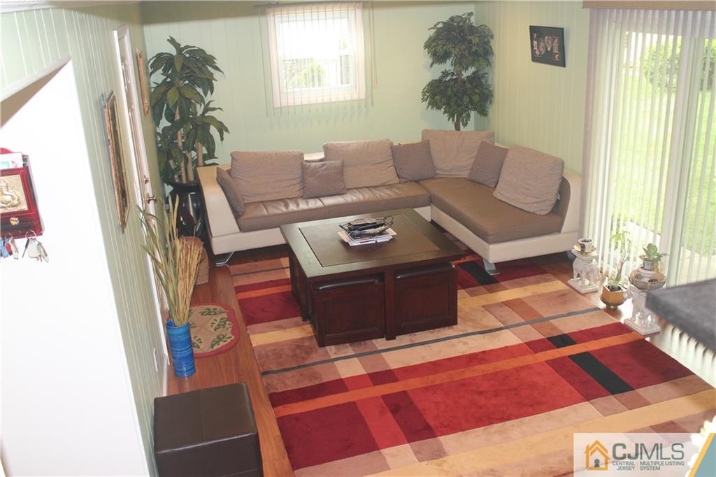 7 Lydia Lane Edison, NJ 08817 - Photo 3 of 17 a living room with furniture and a window