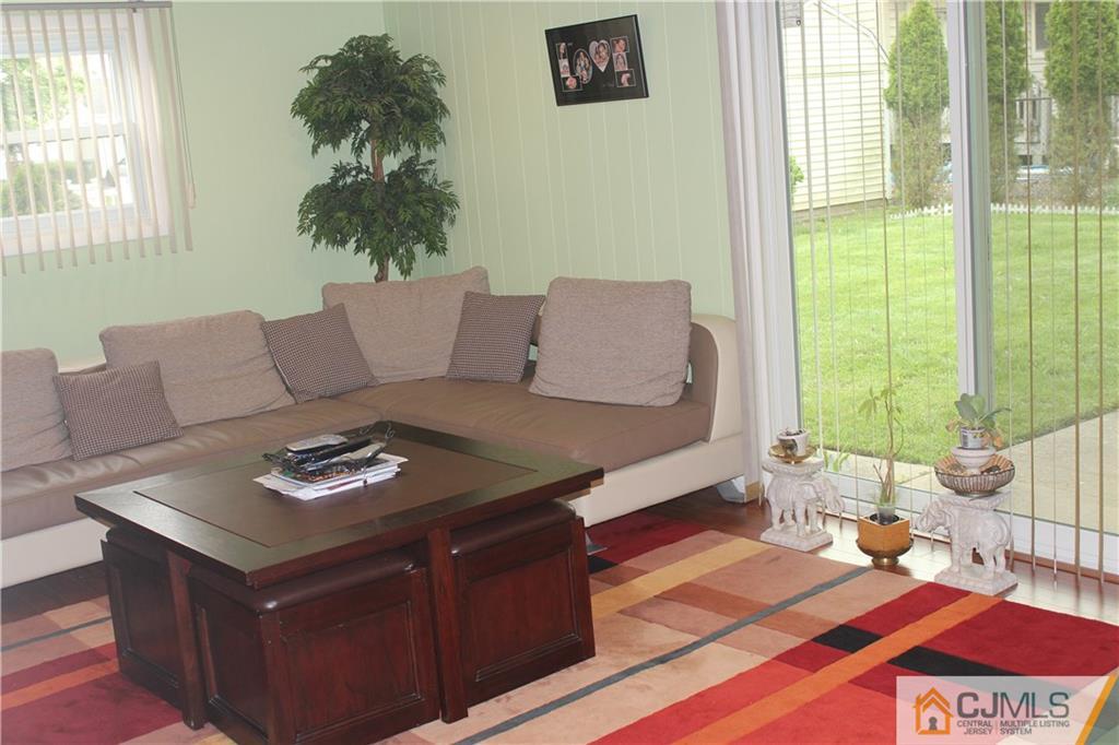 7 Lydia Lane Edison, NJ 08817 - Photo 4 of 17 a living room with furniture and a window