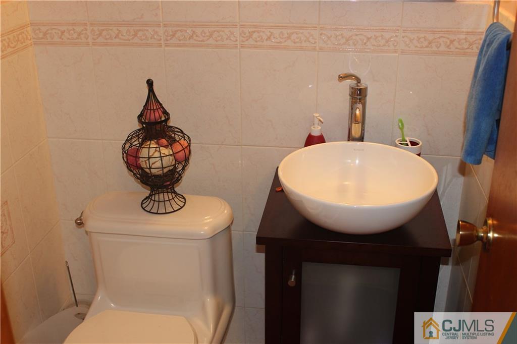7 Lydia Lane Edison, NJ 08817 - Photo 6 of 17 a bathroom with a toilet and sink