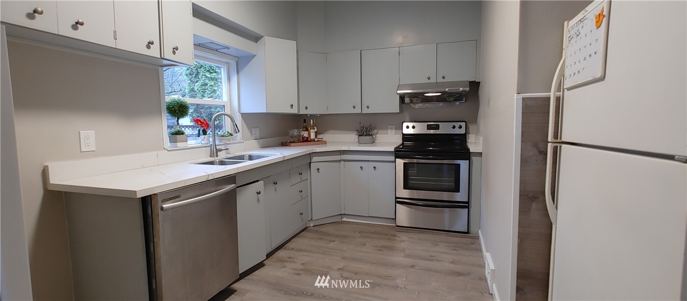 522 Wells Avenue South Renton, WA 98057 - Photo 11 of 19 a kitchen with a sink appliances and cabinets