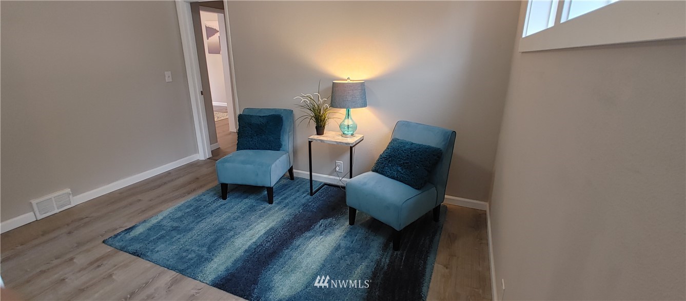 522 Wells Avenue South Renton, WA 98057 - Photo 15 of 19 a living room with furniture and a chair