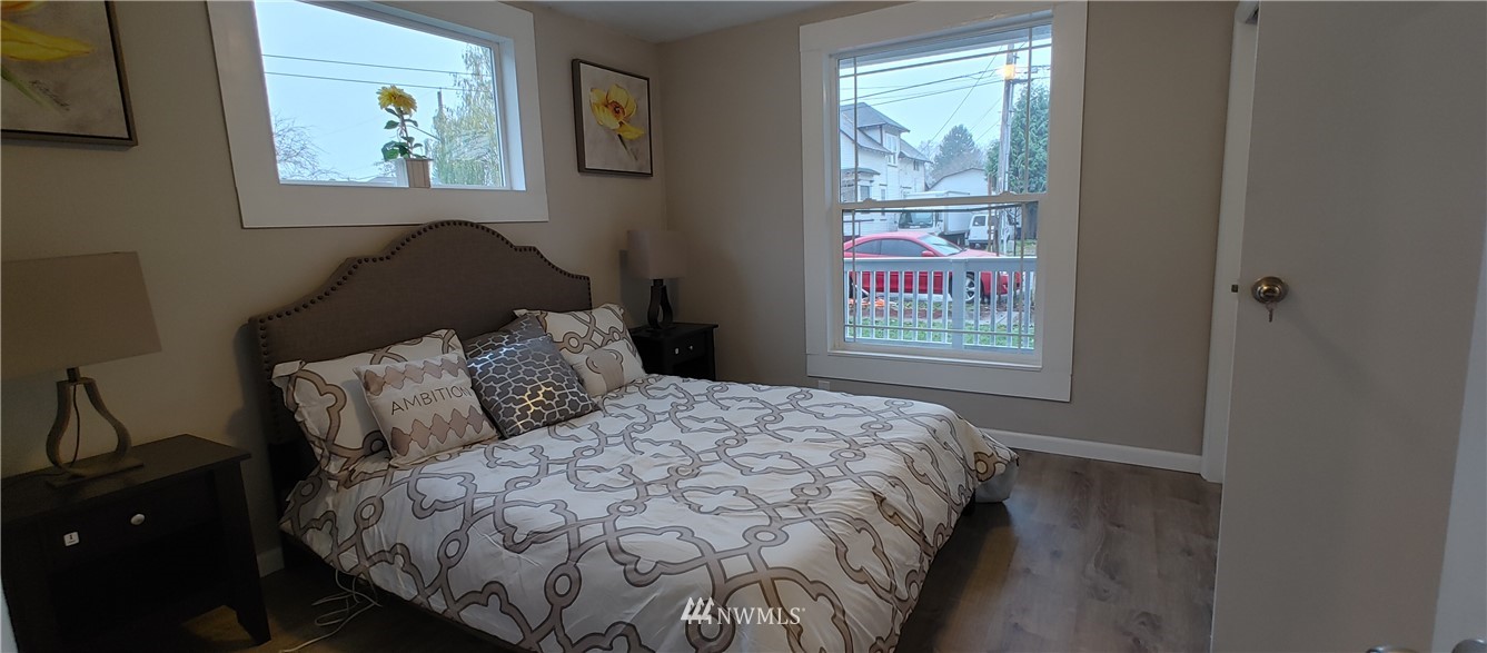 522 Wells Avenue South Renton, WA 98057 - Photo 17 of 19 a bed sitting in a bedroom next to a window
