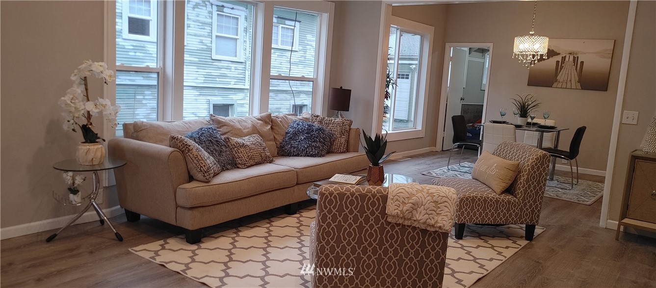522 Wells Avenue South Renton, WA 98057 - Photo 3 of 19 a living room with furniture and a window
