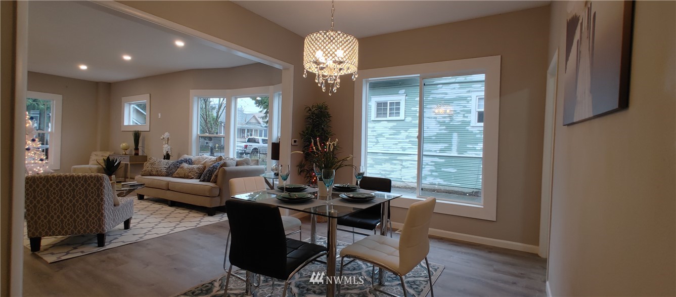 522 Wells Avenue South Renton, WA 98057 - Photo 8 of 19 a living room with furniture and a chandelier