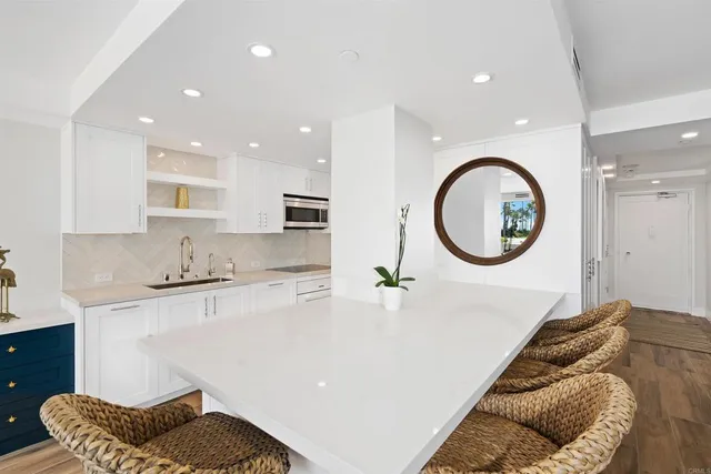 a living room with a couch and a sink