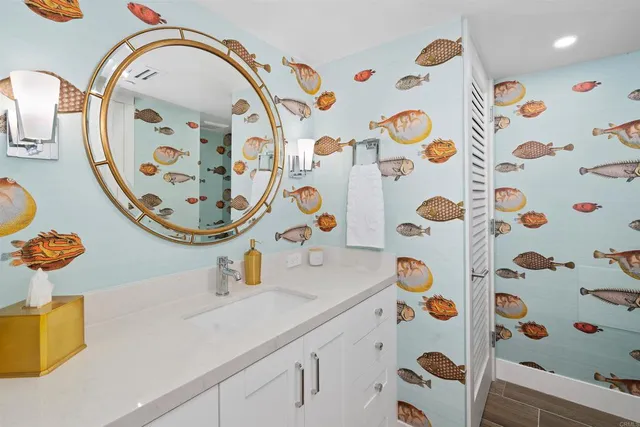 a bathroom with a sink a mirror and shower curtain