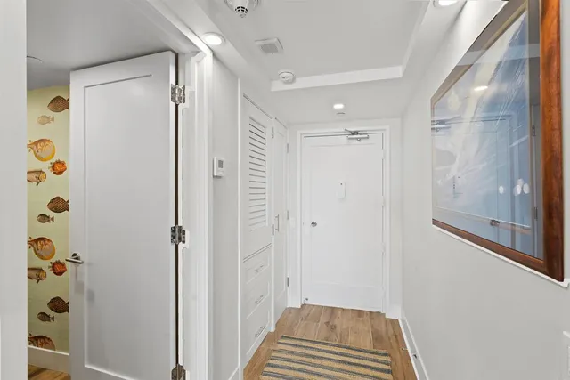 a bathroom with a shower and a glass door